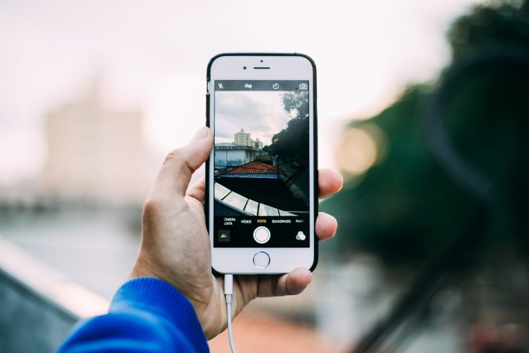 A gamer using a smartphone to play a cloud-based game